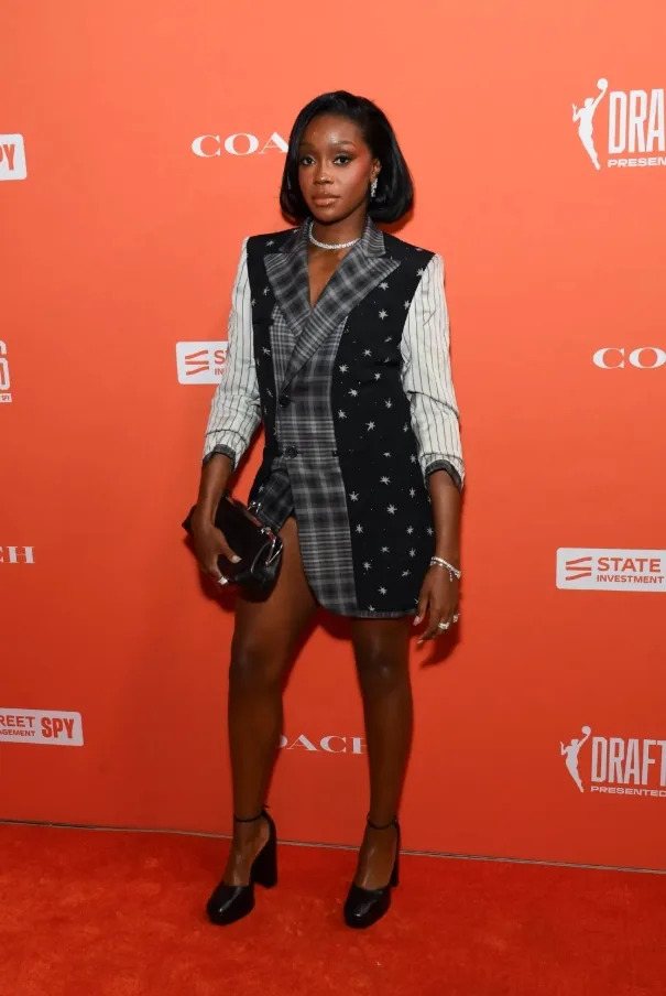 Raven Johnson mixed tailoring and texture with a statement blazer-style dress and platform pumps.