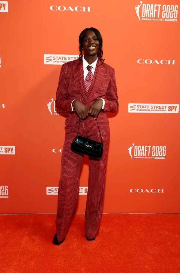 Madina Okot updated classic suiting with a red pinstripe look and subtle mixed patterns.