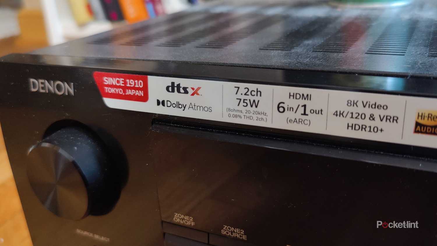 Black denon 760h receiver with stick on it.