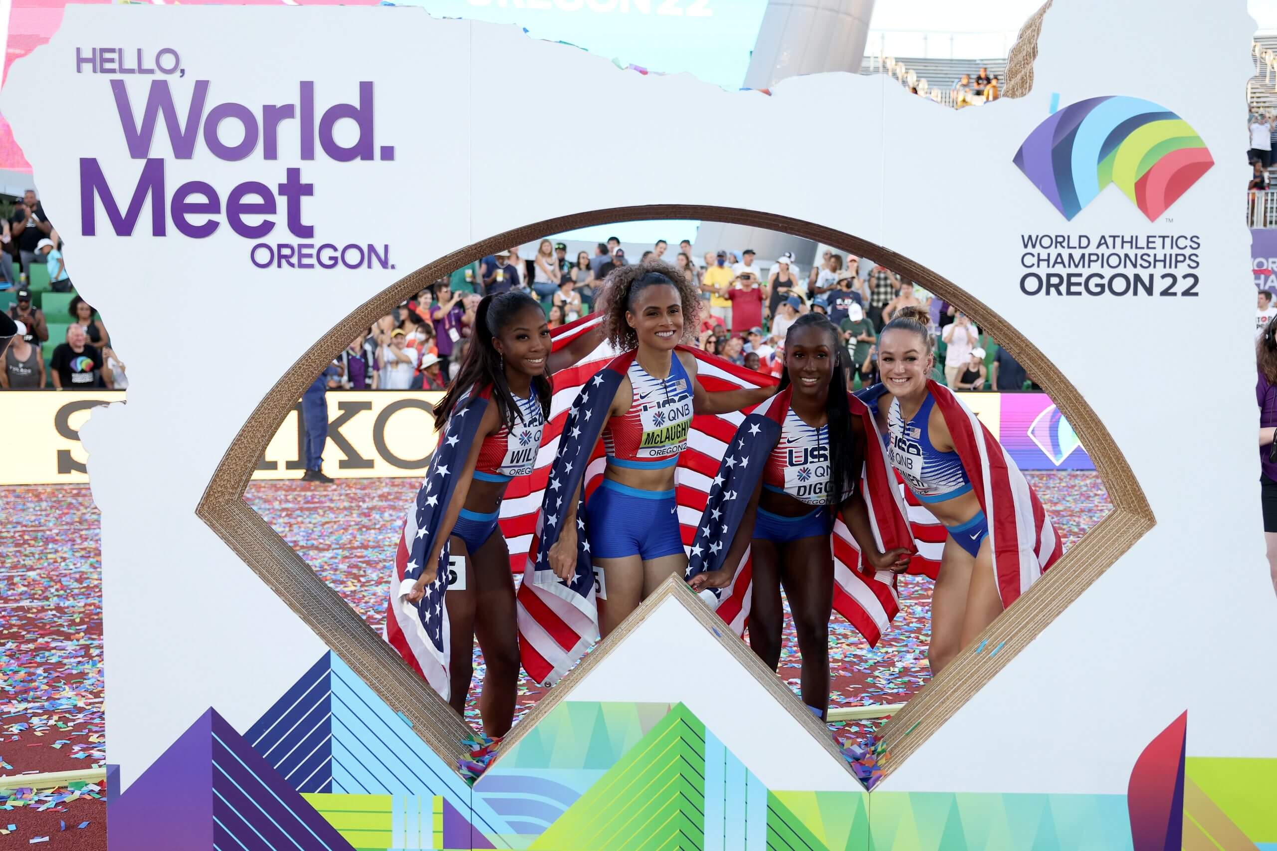 Steiner standing with Britton Wilson, Sydney McLaughlin and Talitha Diggs after winning the 4x400m relay at the 2022 World Athletics Championships in Oregon