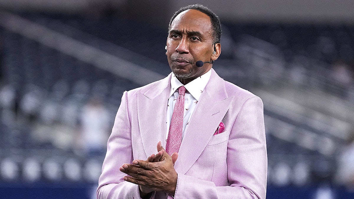 Stephen A. Smith standing on the field during warmups at AT&T Stadium in Arlington, Texas.