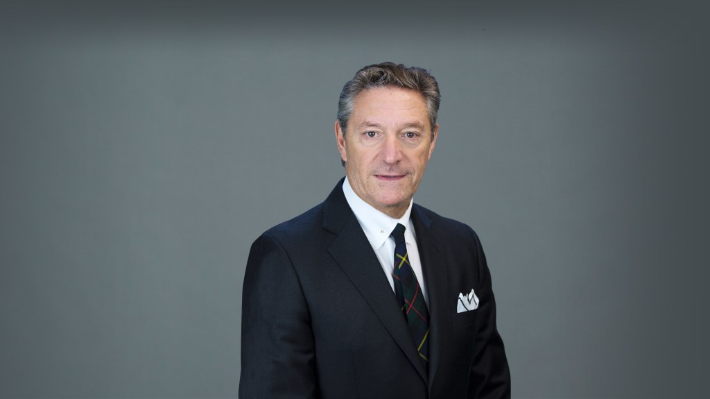 Headshot of Steven Lamm in a suit and tie.