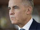 Prime Minister Mark Carney listens during a meeting with New Brunswick Premier Susan Holt in his office on the Parliamentary Precinct in Ottawa April 20, 2026.  