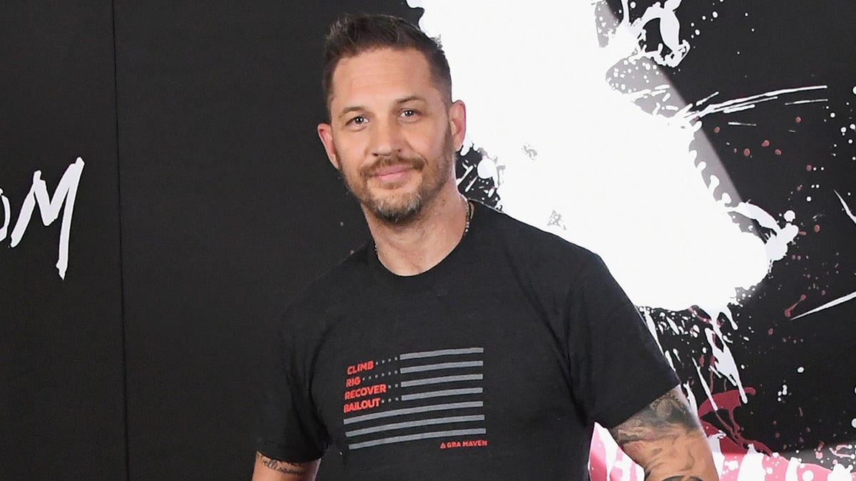 Tom Hardy standing at a photo call for Columbia Pictures' Venom in Los Angeles