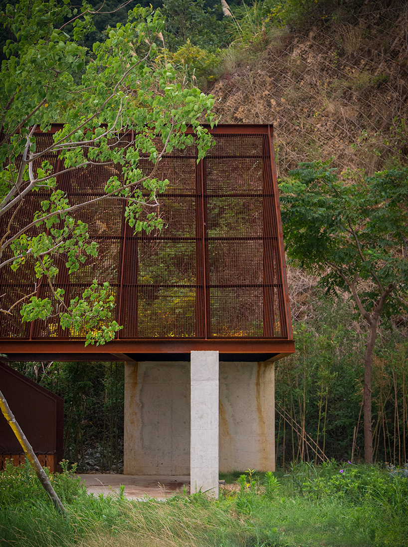 corten-clad twin pavilions frame shifting sea views along chinese coastal valley - 6