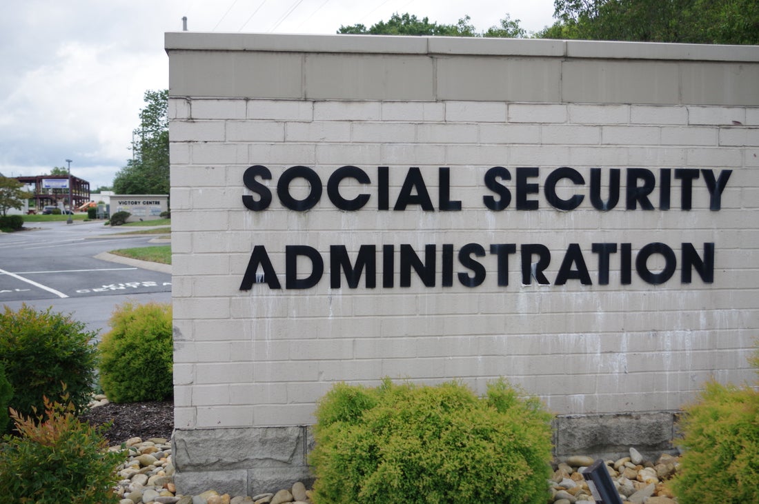 A brick sign with the words "Social Security Administration" in large black letters.