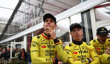 Team Visma - Lease a Bike's Belgian rider Wout van Aert (L) and British rider Matthew Brennan stand with teammates during the teams' presentations event on the eve of Paris-Roubaix