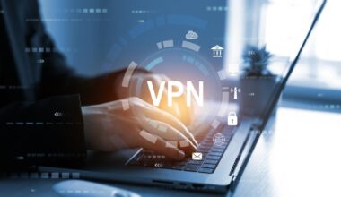 Person sitting at computer with VPN graphic logo shown