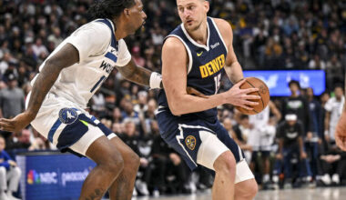 DENVER , CO - APRIL 27: Nikola Jokic (15) of the Denver Nuggets backs down Naz Reid (11) of the Minnesota Timberwolves during the fourth quarter of the Nuggets' 125-113 win in game five of their NBA Playoffs series on Monday, April 27, 2026. The Timberwolves lead 3-2 as they head back to Minneapolis for game six.