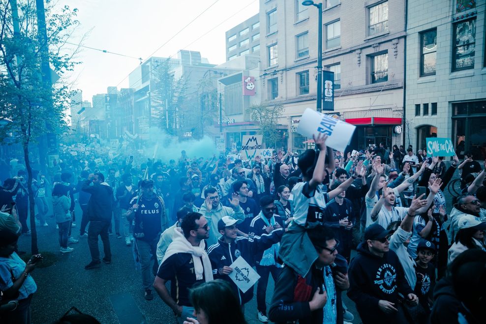 whitecaps fans march to the match