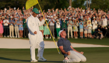 Rory McIlroy of Northern Ireland celebrates winning with caddie Harry Diamond after winning the 2025 Masters