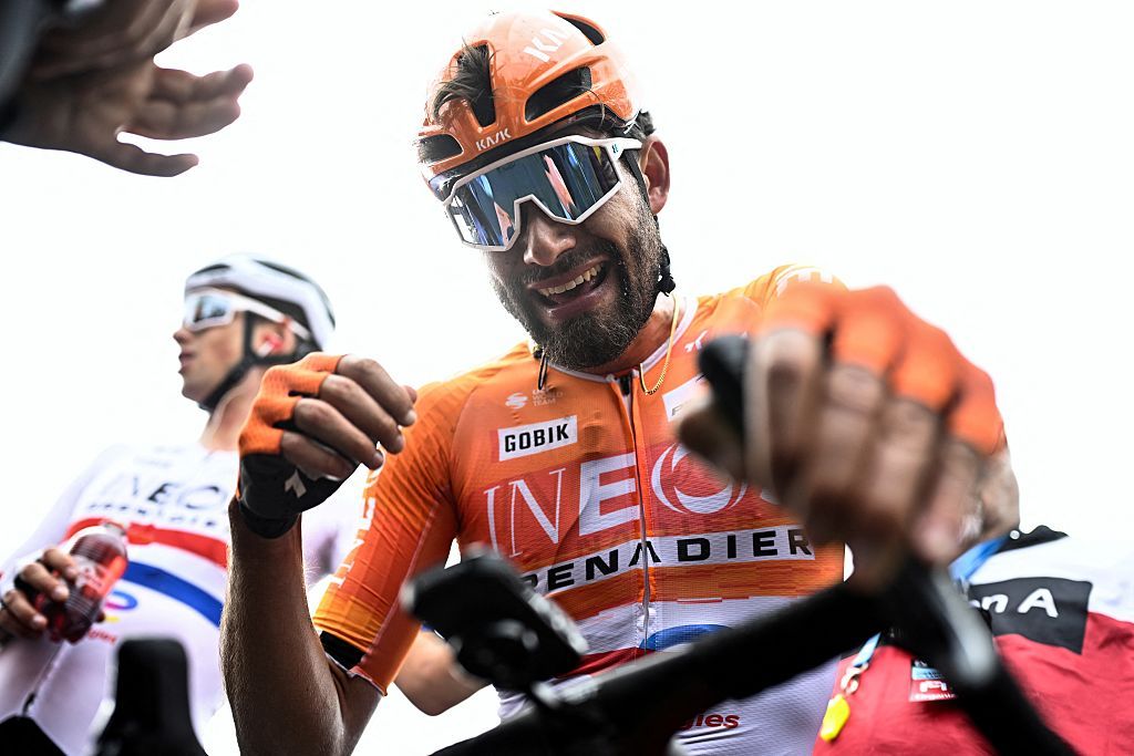 INEOS Grenadiers's Italian rider Filippo Ganna celebrates after winning the men's elite race of the Dwars door Vlaanderen cycling event, 184.6km from Roeselare to Waregem on April 1, 2026. (Photo by JASPER JACOBS / BELGA / AFP) / Belgium OUT