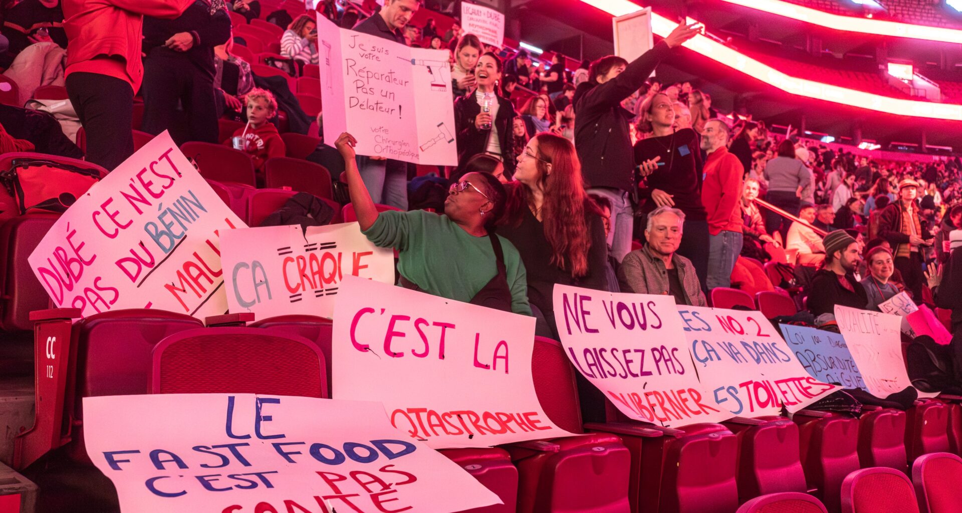 Protest signs on seats at the Bell Centre.