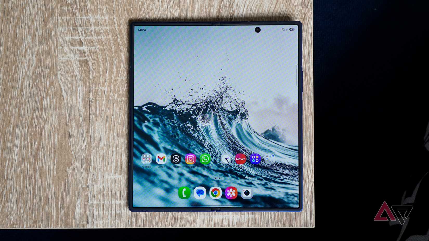 The Galaxy Z Fold 7 opened on a brown wooden table