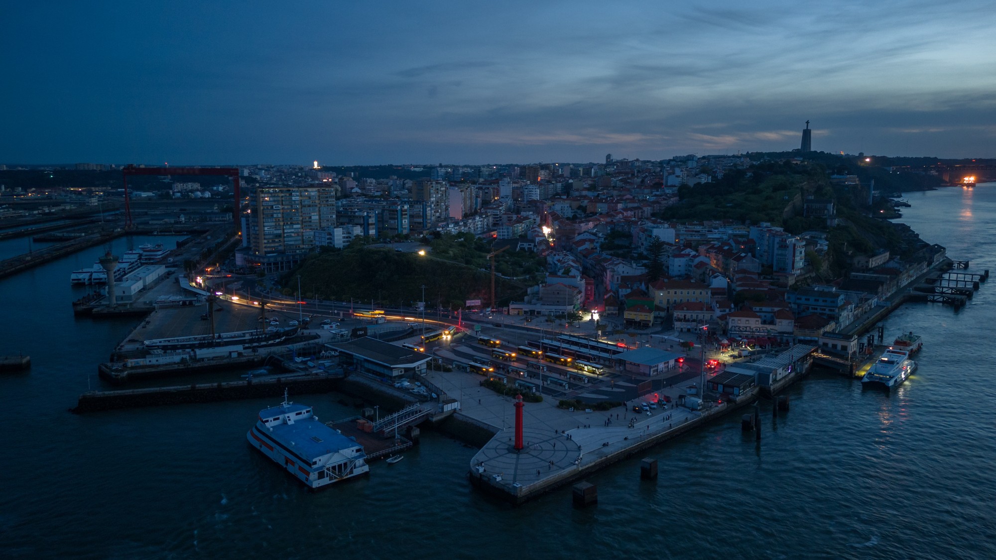 a city scene bathed in darkness with limited lights on.