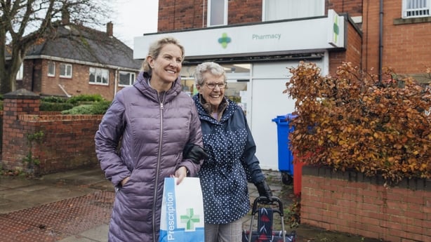 A mature woman out and about with her mother 
