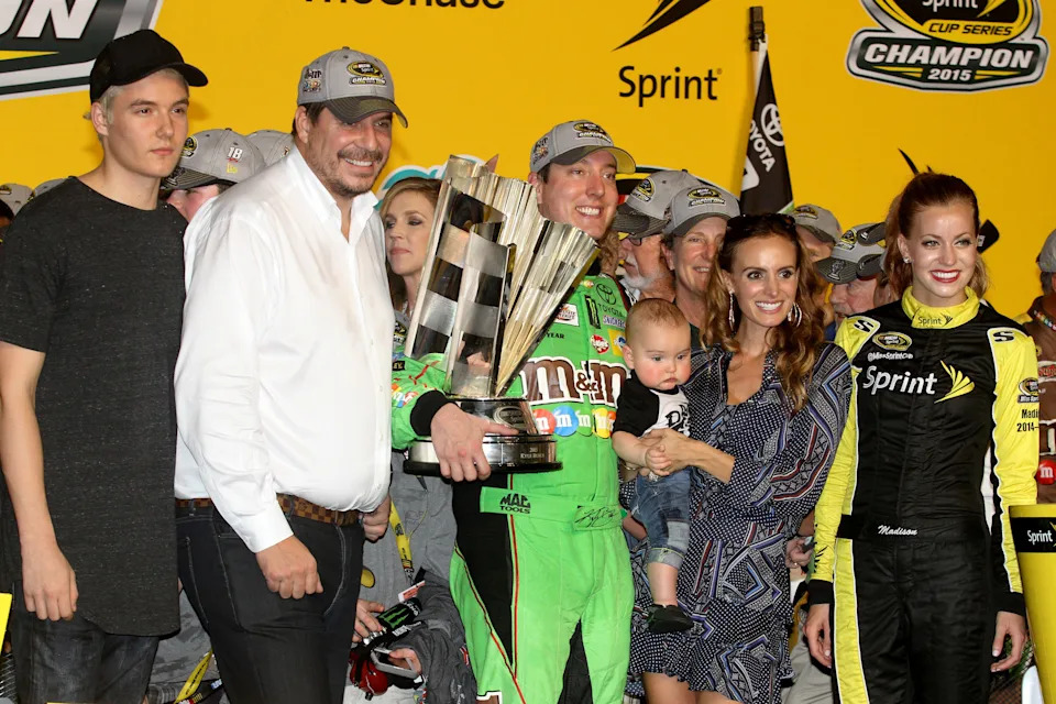 Kyle Busch celebrates winning the 2018 NASCAR Cup championship.