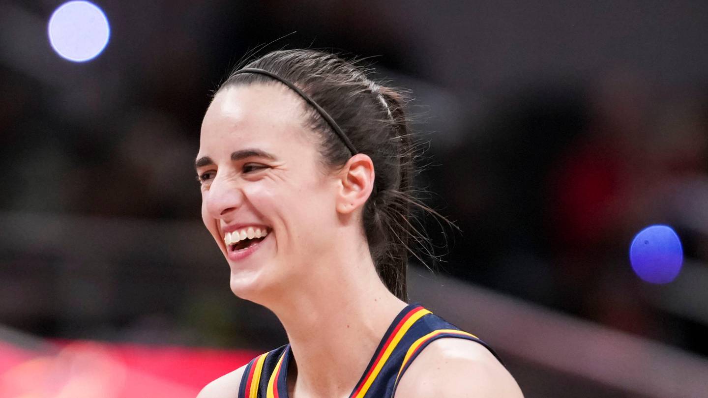 Indiana Fever guard Caitlin Clark (22) smiles Saturday, May 2, 2026, during the first half of a preseason game at Gainbridge Fieldhouse in Indianapolis.