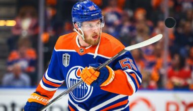 Jun 21, 2024; Edmonton, Alberta, CAN; Edmonton Oilers left wing Dylan Holloway (55) controls the puck during the warmup period against the Florida Panthers in game six of the 2024 Stanley Cup Final at Rogers Place. Mandatory Credit: Sergei Belski-Imagn Images