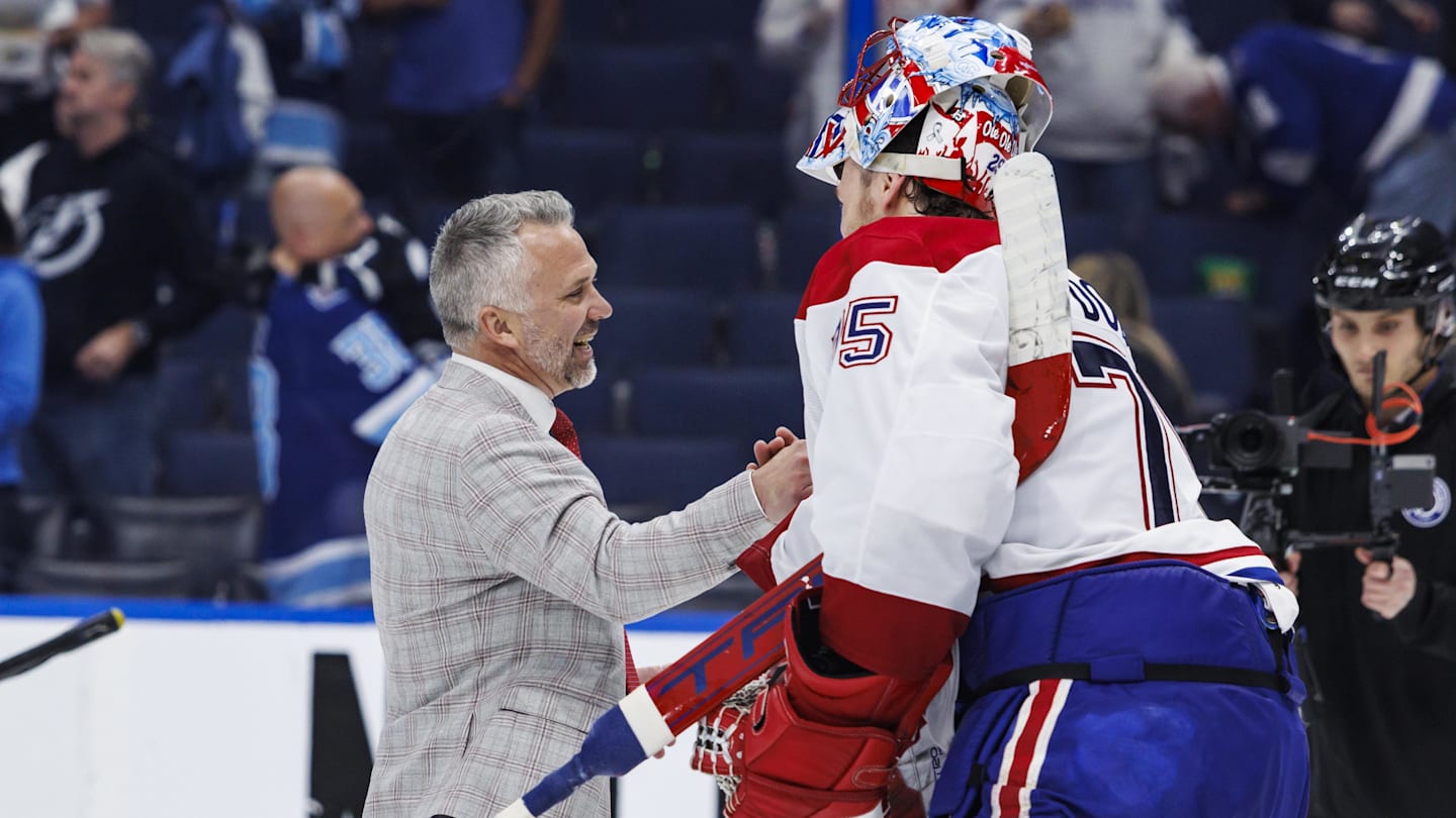 May 3, 2026; Tampa, Florida, USA; the Montreal Canadiens head coach Martin St. Louis and goalie Jakub Dobes (75) react to beating the Tampa Bay Lightning in game seven of the first round of the 2026 Stanley Cup Playoffs at Benchmark International Arena. Mandatory Credit: Morgan Tencza-Imagn Images