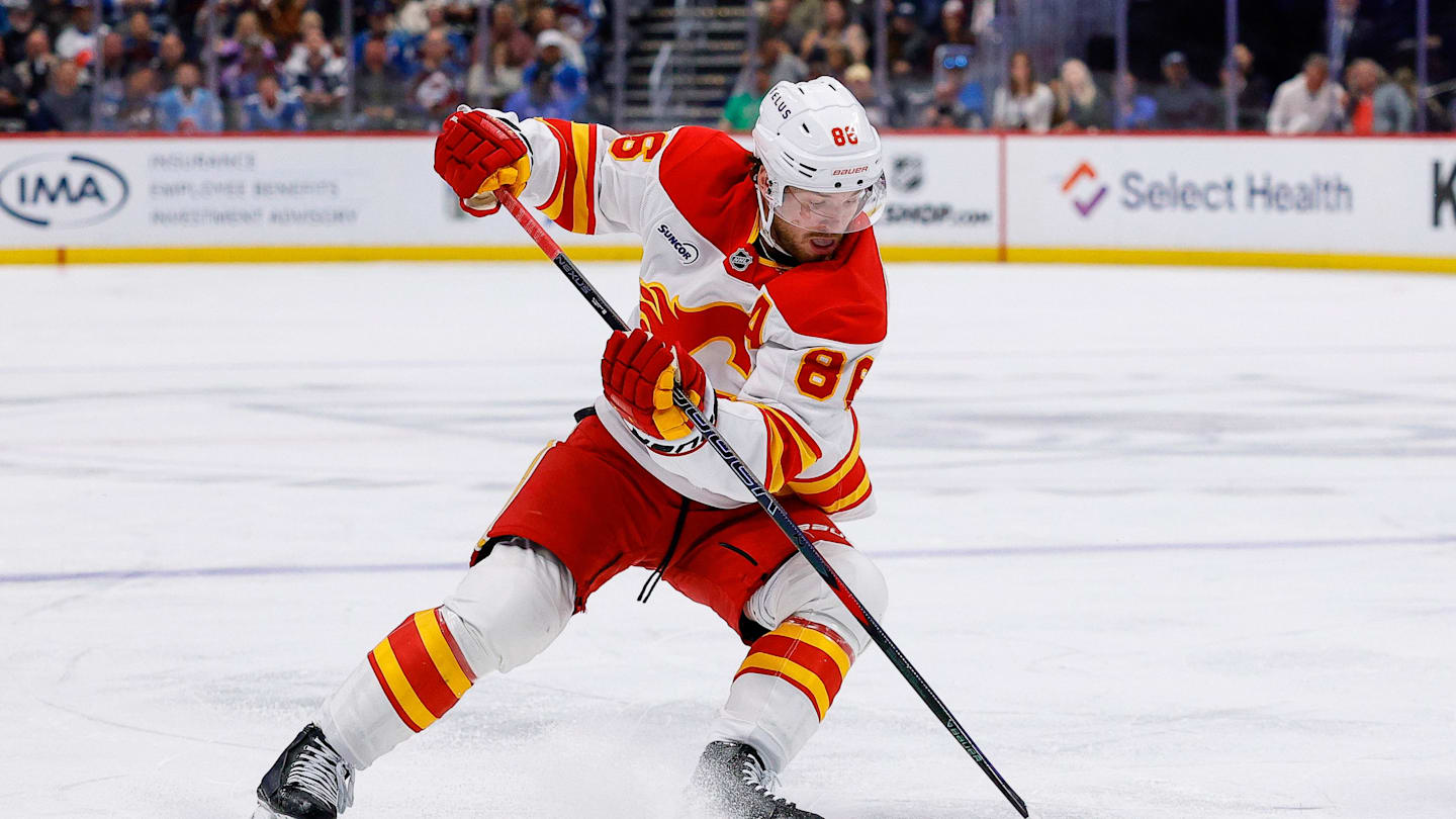 Apr 9, 2026; Denver, Colorado, USA; Calgary Flames left wing Joel Farabee (86) controls the puck in the third period against the Colorado Avalanche at Ball Arena. Mandatory Credit: Isaiah J. Downing-Imagn Images