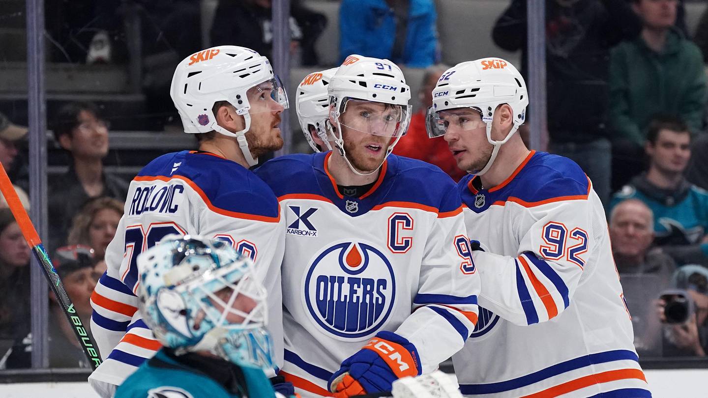 Apr 8, 2026; San Jose, California, USA;  Edmonton Oilers center Connor McDavid (97) is congratulated by teammates after scoring against the San Jose Sharks during the first period at SAP Center at San Jose. Mandatory Credit: David Gonzales-Imagn Images