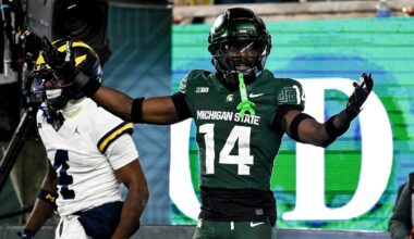 Michigan State's Malcolm Bell, right, reacts after getting called for pass interference against Michigan's Andrew Marsh during the first quarter on Saturday, Oct. 25, 2025, at Spartan Stadium in East Lansing.