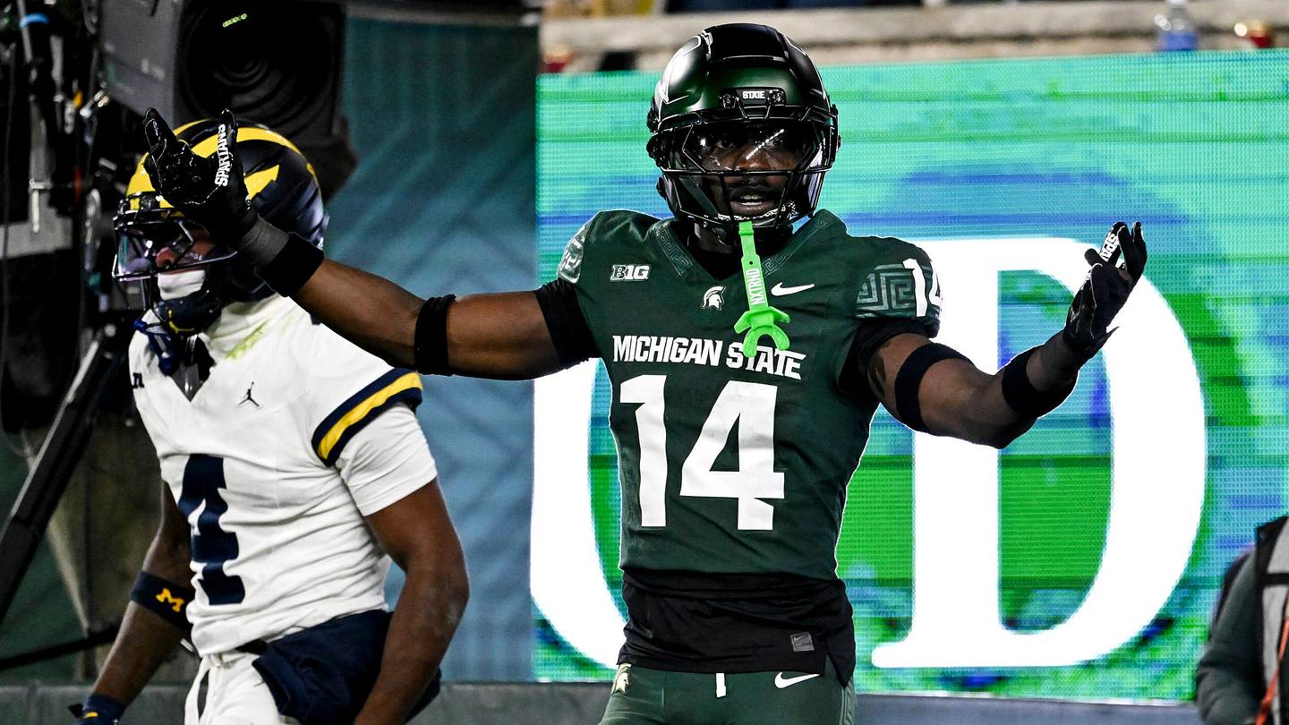 Michigan State's Malcolm Bell, right, reacts after getting called for pass interference against Michigan's Andrew Marsh during the first quarter on Saturday, Oct. 25, 2025, at Spartan Stadium in East Lansing.