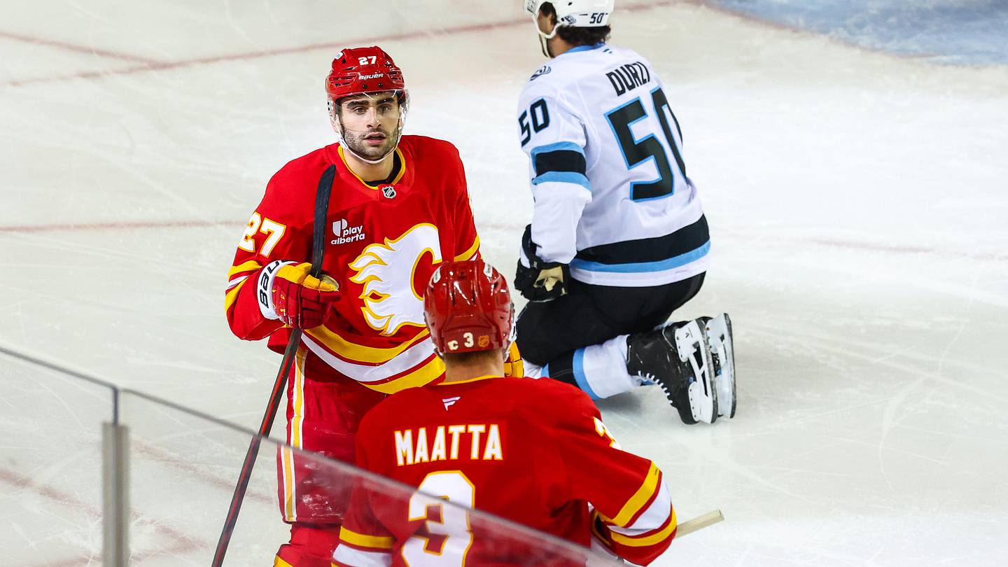 Apr 12, 2026; Calgary, Alberta, CAN; Calgary Flames right wing Matt Coronato (27) celebrates his goal with teammates against the Utah Mammoth during the first period at Scotiabank Saddledome. Mandatory Credit: Sergei Belski-USA TODAY Sports