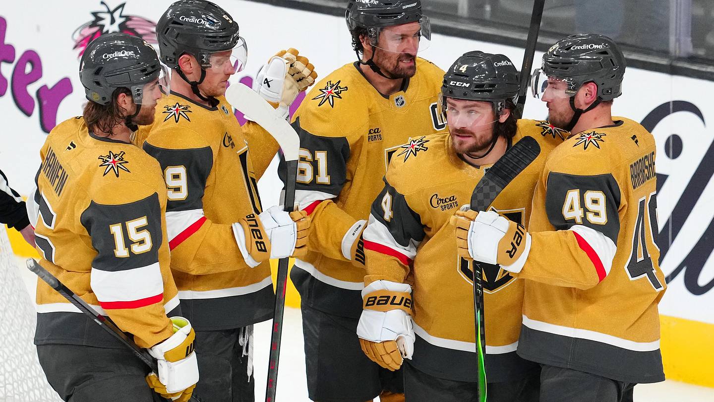 Apr 13, 2026; Las Vegas, Nevada, USA; Vegas Golden Knights defenseman Rasmus Andersson (4) celebrates with team mates after scoring a goal against the Winnipeg Jets during the third period at T-Mobile Arena. Mandatory Credit: Stephen R. Sylvanie-Imagn Images