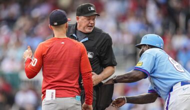 May 23, 2026; Cumberland, Georgia, USA; Atlanta Braves third base coach Tommy Watkins (84) tries to get a ball from umpire John Libka (84) while a discussion about a call takes place with Washington Nationals manager Blake Butera (10) during the seventh inning at Truist Park. Mandatory Credit: Dale Zanine-Imagn Images