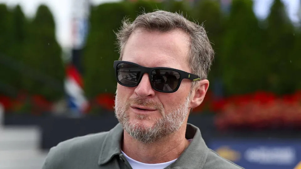 Jul 19, 2025; Dover, Delaware, USA; NASCAR Xfinity Series owner Dale Earnhardt Jr. looks on from pit road during the BetRivers 200 at Dover Motor Speedway. Mandatory Credit: Matthew O'Haren-Imagn ImagesMatthew O'Haren-Imagn Images.