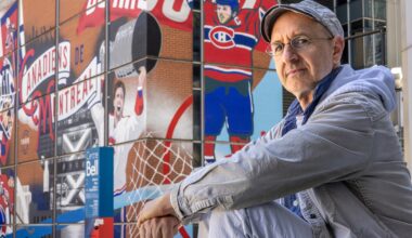Oren Safdie sits outside with a Bell Centre mural of Canadiens players in the background.