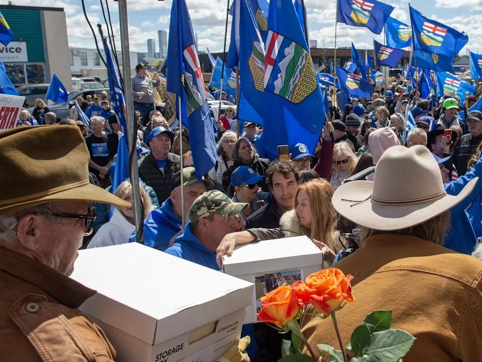 Stay Free Alberta, delivered the signature documentation to Elections Alberta headquarters in Edmonton surrounded by a sea of supporters with Alberta flags.