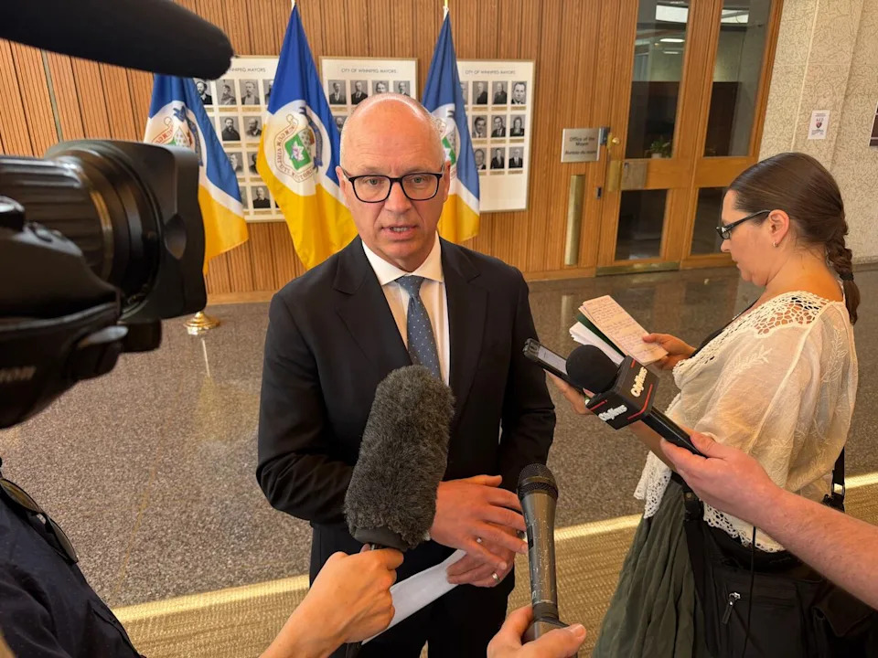 Winnipeg Mayor Scott Gillingham speaks with reporters at city hall on Tuesday.