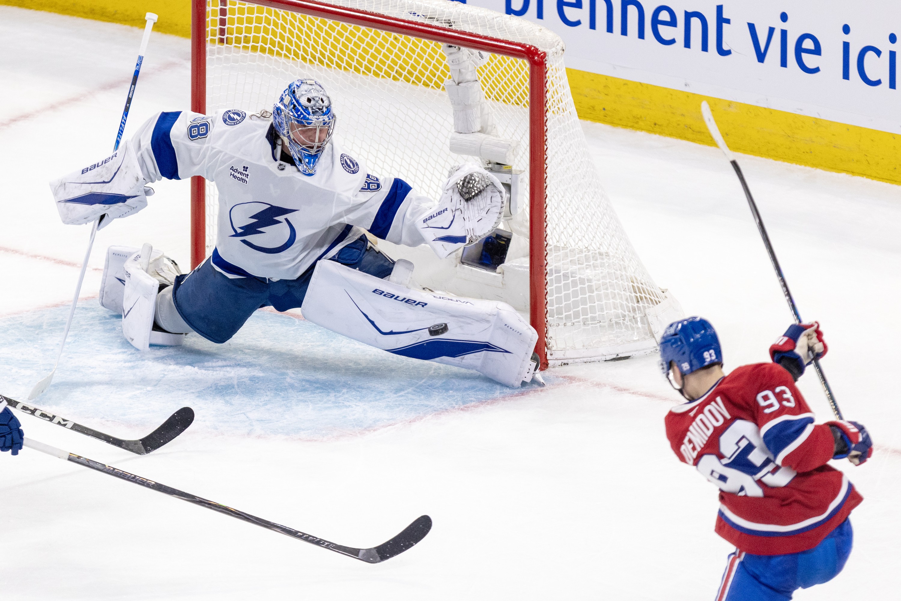 Lightning goalie Andrei Vasilevskiy slides to his left across his crease to make a nice pad save on Canadiens' Ivan Demidov.