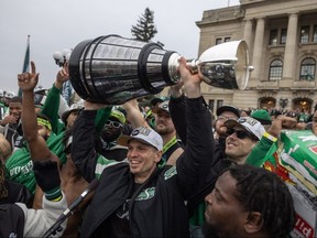 Saskatchewan Roughriders quarterback Trevor Harris raises the Grey Cup