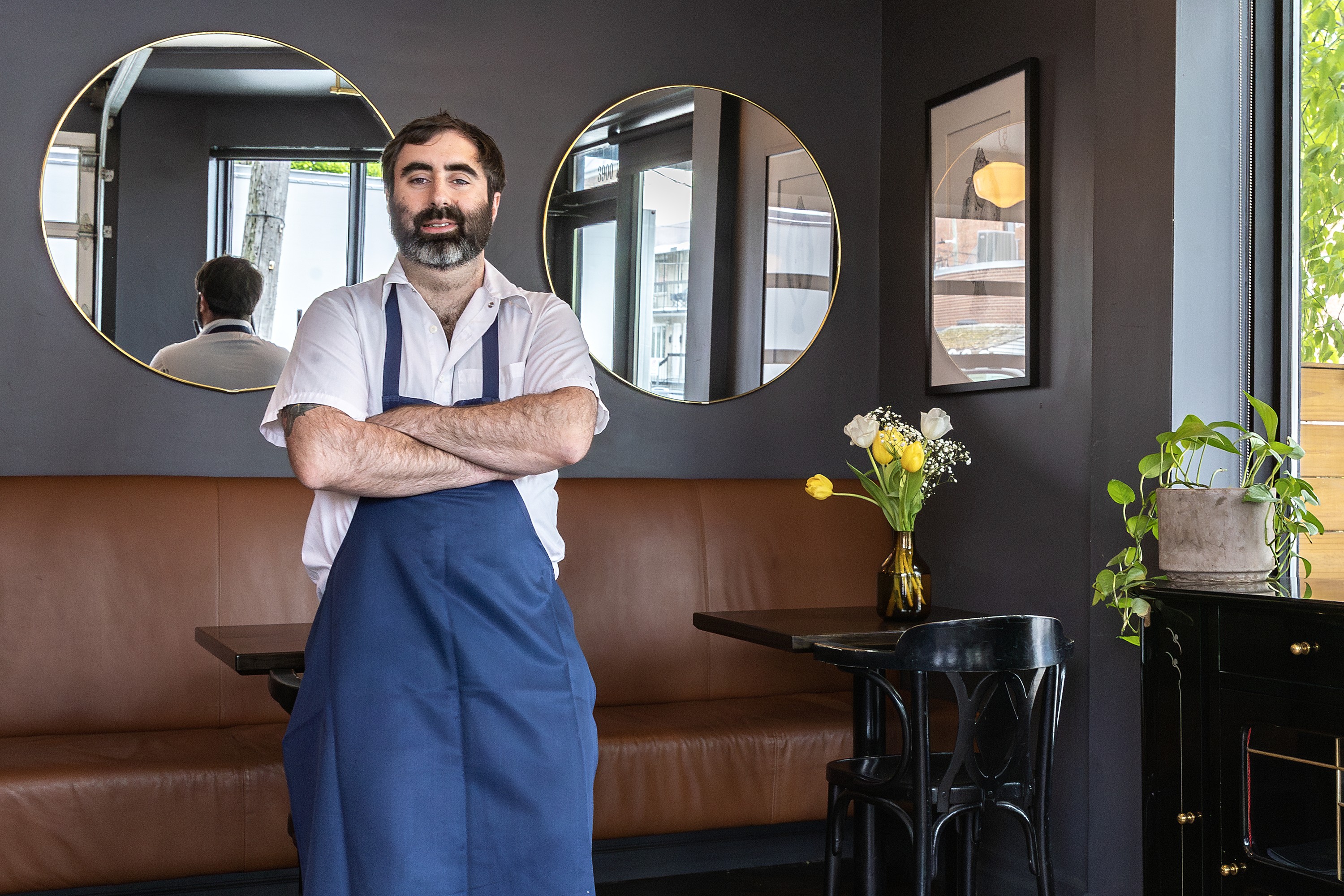 Chef Ariel Schor leans on a table in Verdun gem Beba.