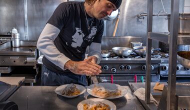 Pasta Pooks chef in the kitchen preparing plates.