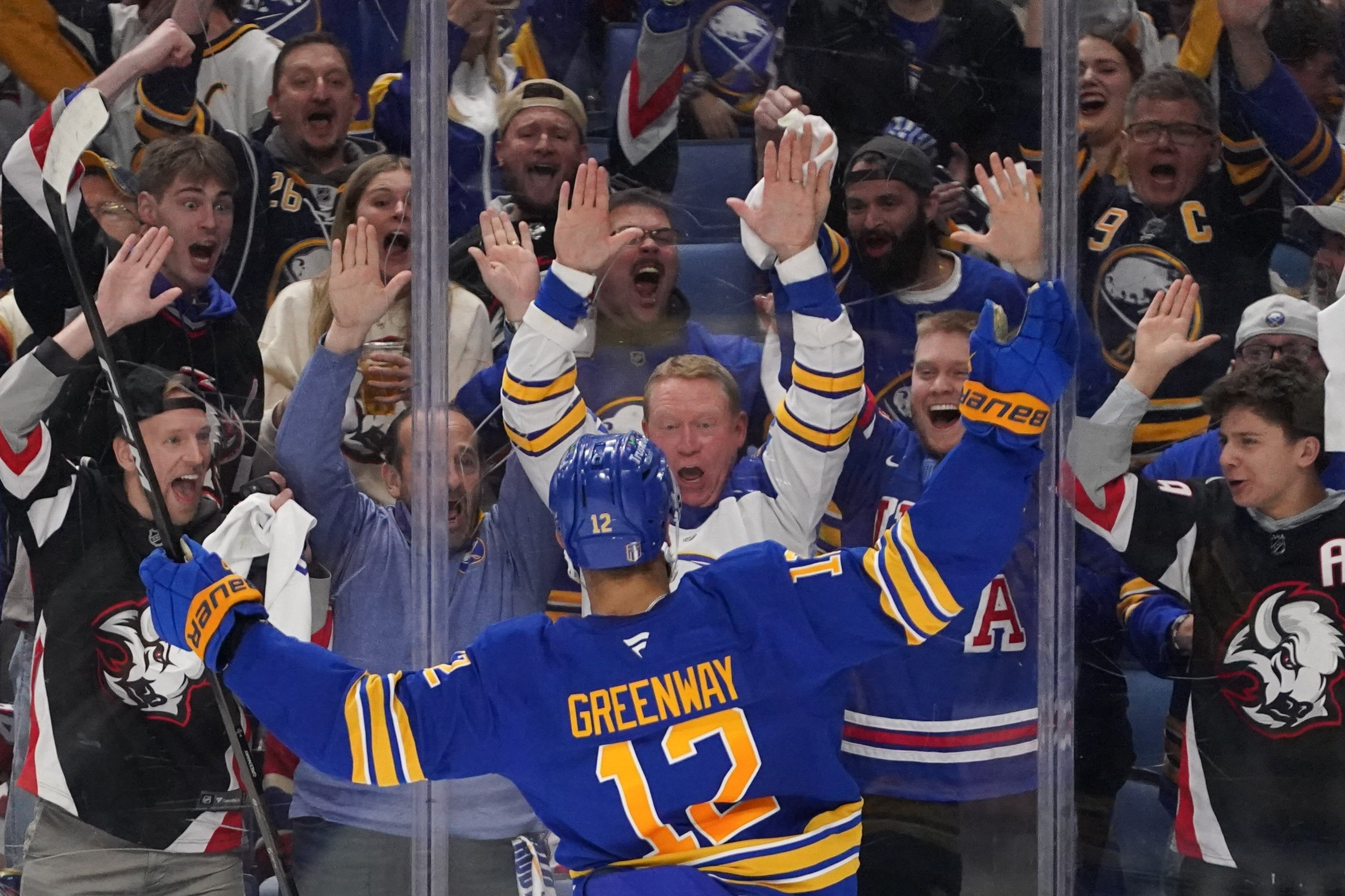 Buffalo Sabres left wing Jordan Greenway (12) celebrates his goal with fans in the second period of the first game against the Montréal Canadiens in the second round of the Stanley Cup Playoffs at KeyBank Center on Wednesday, May 6, 2026. (Joed Viera/Buffalo News)