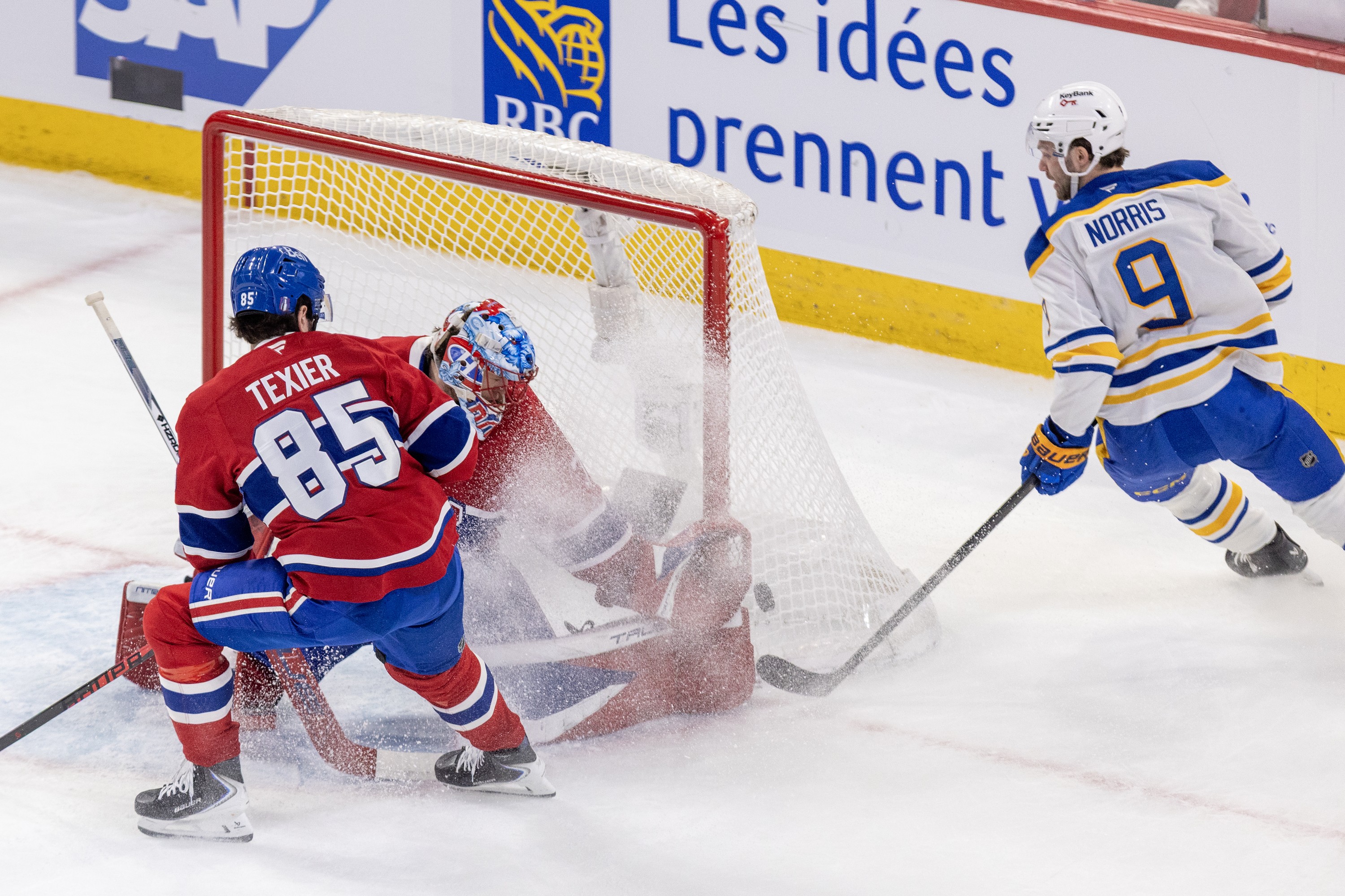 Montreal Canadiens' Jakub Dobes makes a save on a rebound attempt by Buffalo Sabres' Josh Norris.