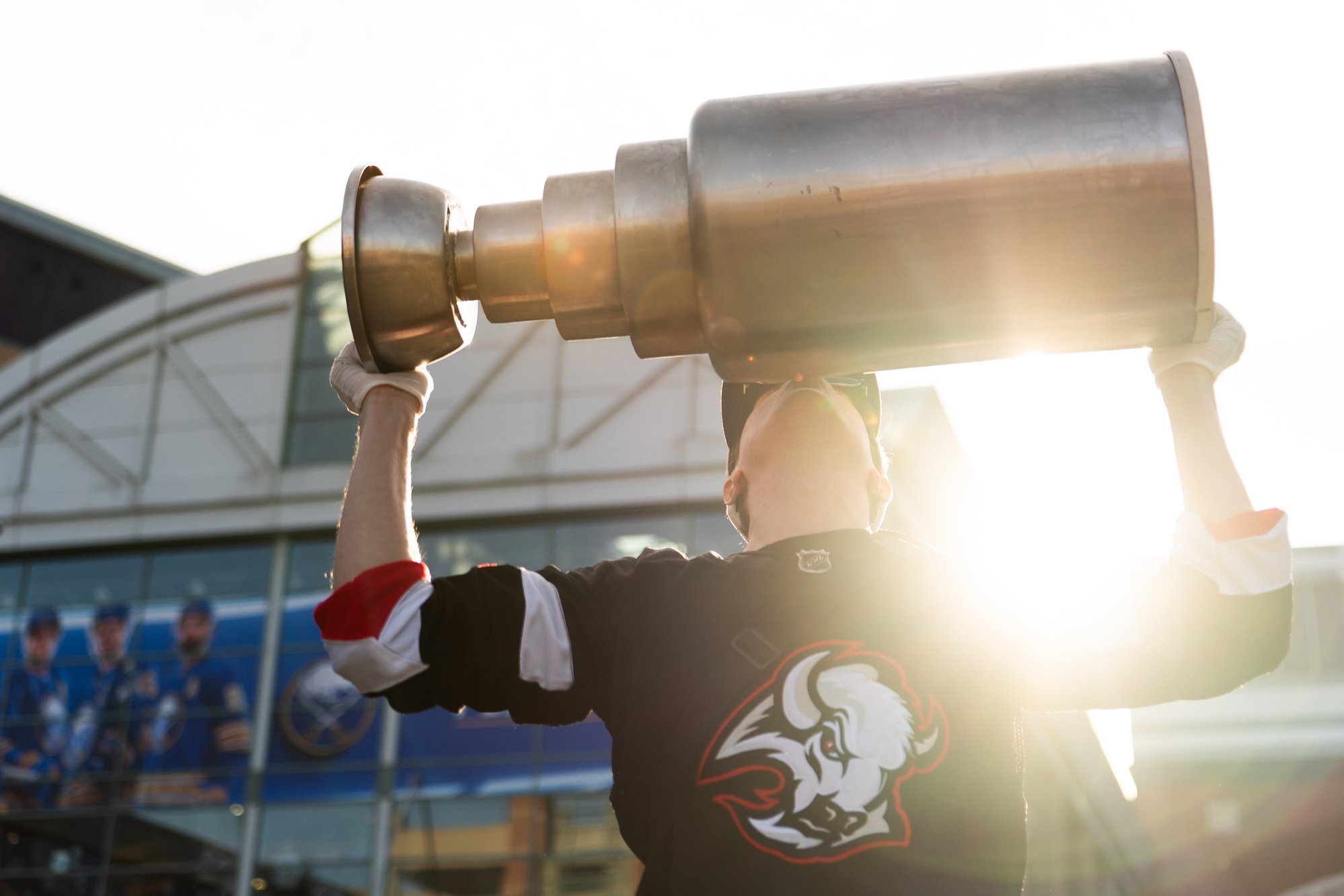 Man kissing Stanley Cup replica