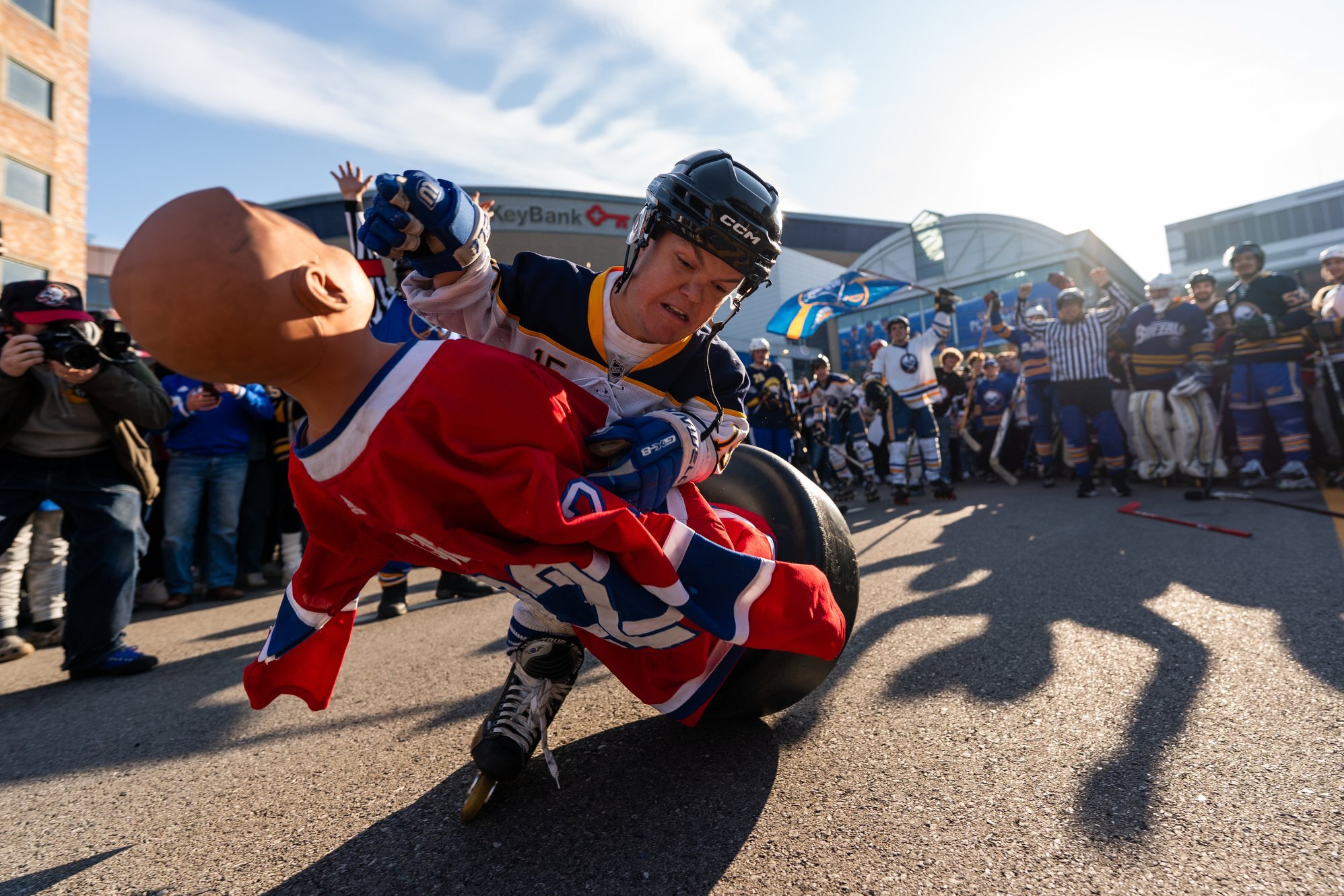 Man tackling dummy wearing Canadiens jersey