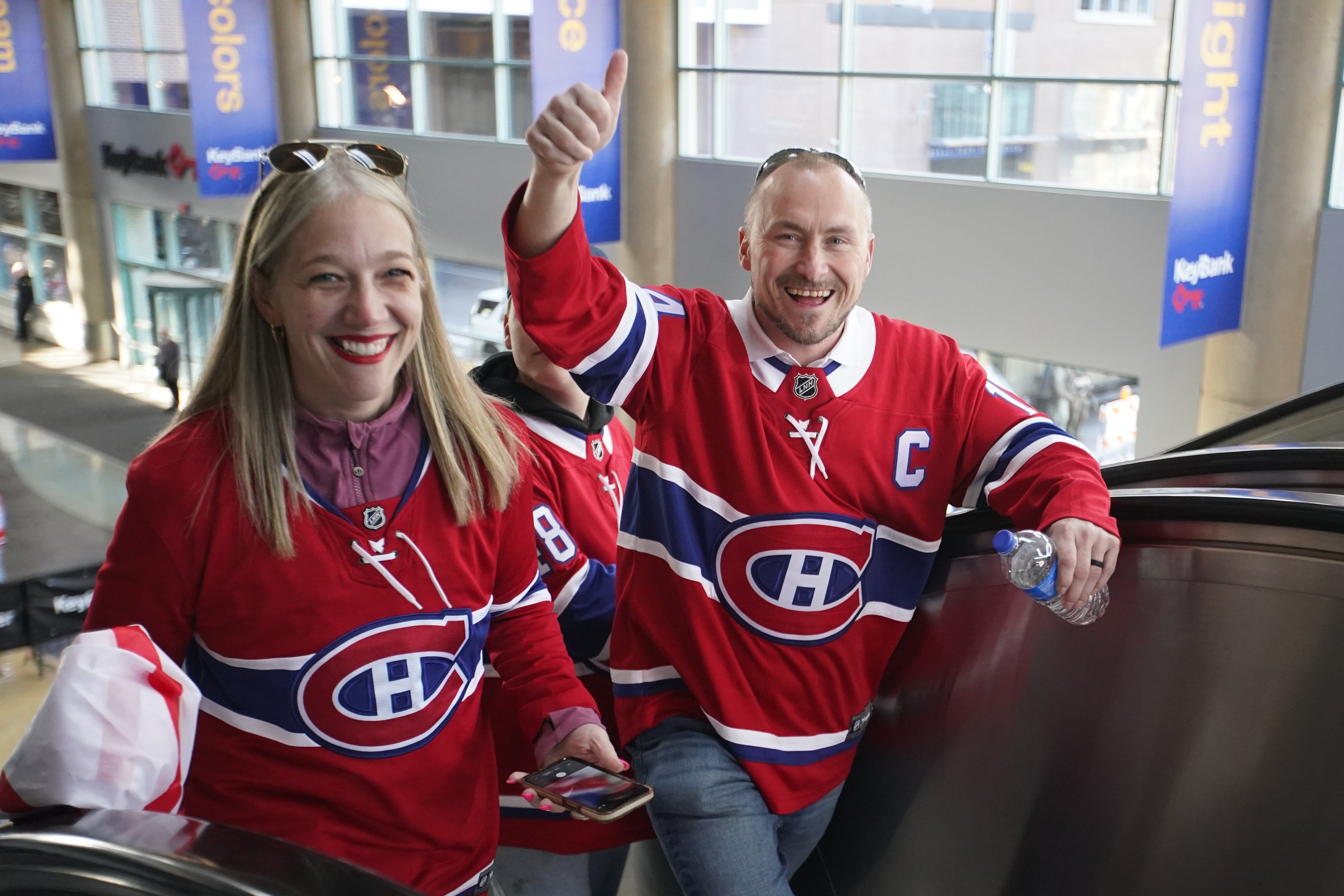 Two people wearing Montreal Canadiens jerseys