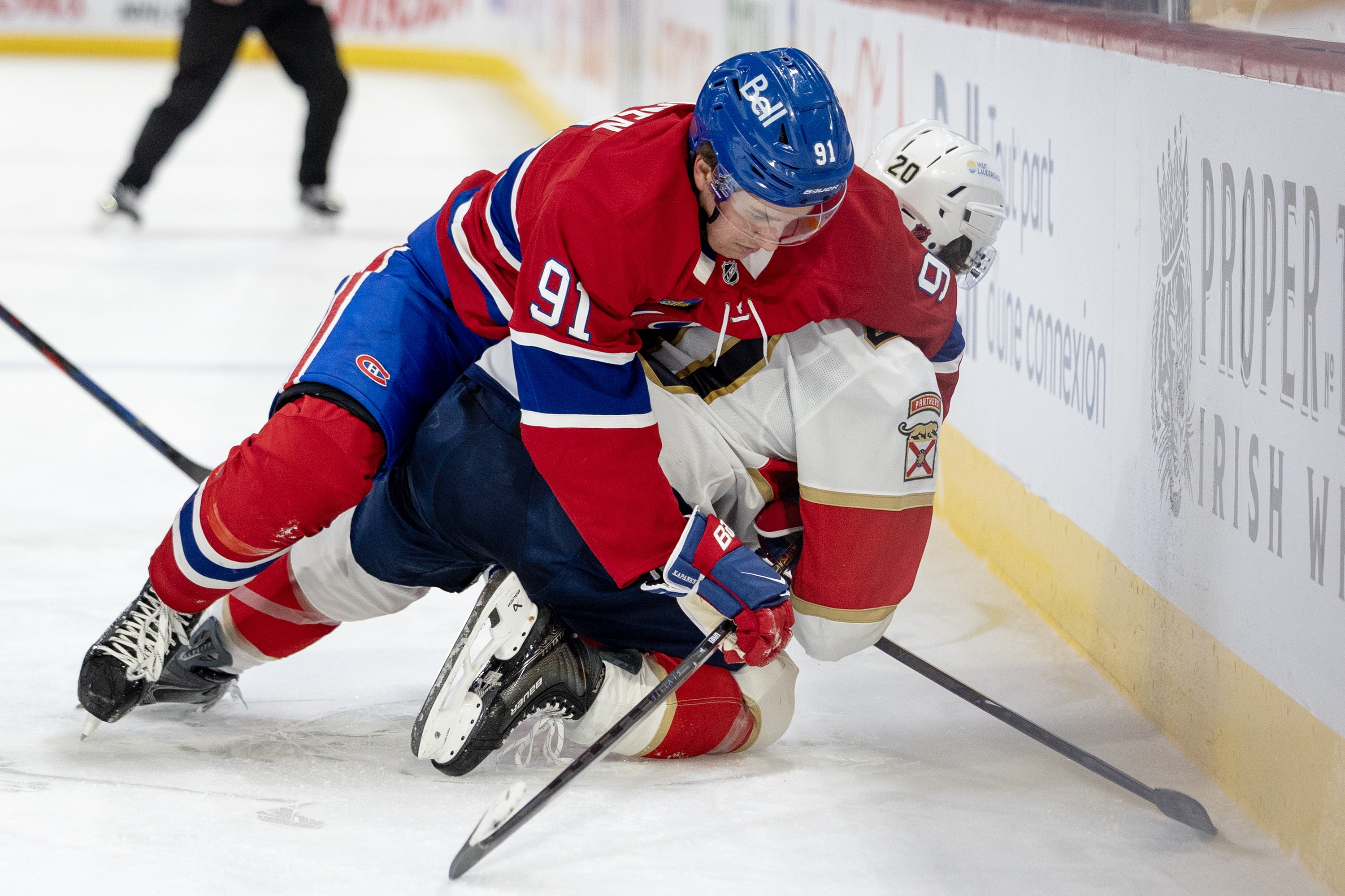 Canadiens forward Oliver Kapanen ties up Florida Panthers' Mike Benning during the second period in Montreal on April 7, 2026.