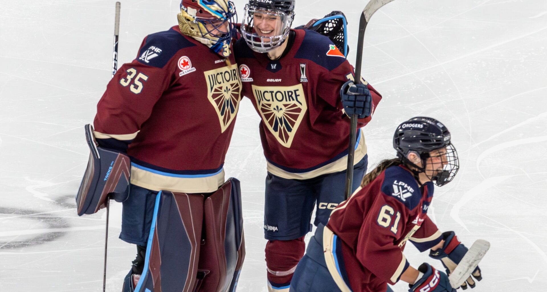 Montreal Victoire goalie Ann-Renée Desbiens is congratulated by teammate Hayley Scamurra after Marie-Philip Poulin scored in the third overtime period against the Minnesota Frost in Game 2 of semifinal at Place Bell in Laval on Tuesday.