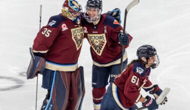 Montreal Victoire goalie Ann-Renée Desbiens is congratulated by teammate Hayley Scamurra after Marie-Philip Poulin scored in the third overtime period against the Minnesota Frost in Game 2 of semifinal at Place Bell in Laval on Tuesday.