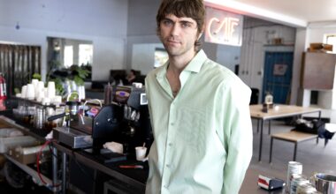 A man stands in a café.