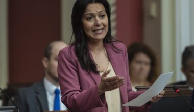 Québec solidaire co-spokesperson Ruba Ghazal gestures with one hand as she holds a piece of paper in the other while speaking in the National Assembly.