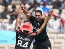 Canada's Saad Bin Zafar, right, celebrates the wicket of New Zealand's Tim Seifert during a T20 World Cup cricket match against New Zealand earlier this year.